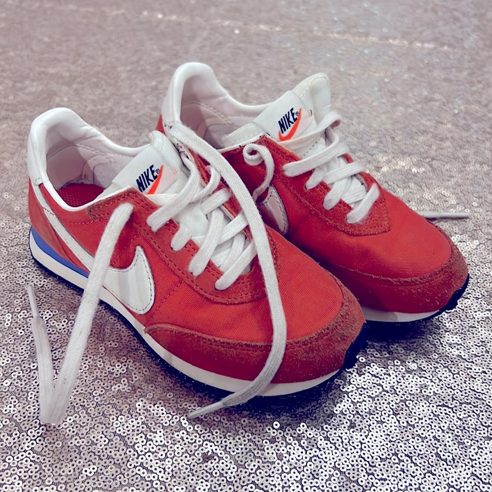 Kids Orange and blue Nike waffle trainer. Slightly used. Size 11 toddler.